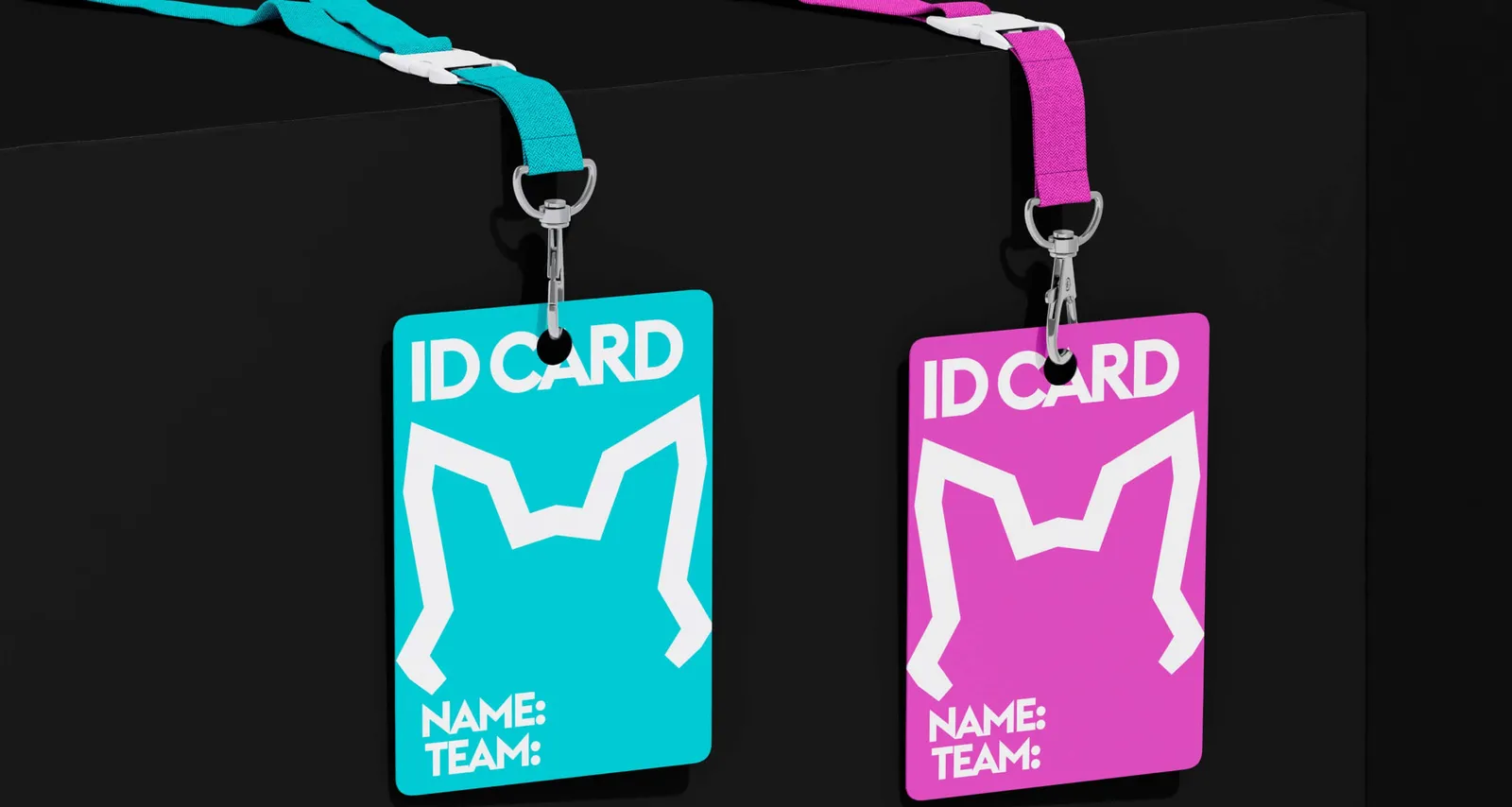 Two ID cards on lanyards in turquoise and magenta, with the fox head as a cut-out