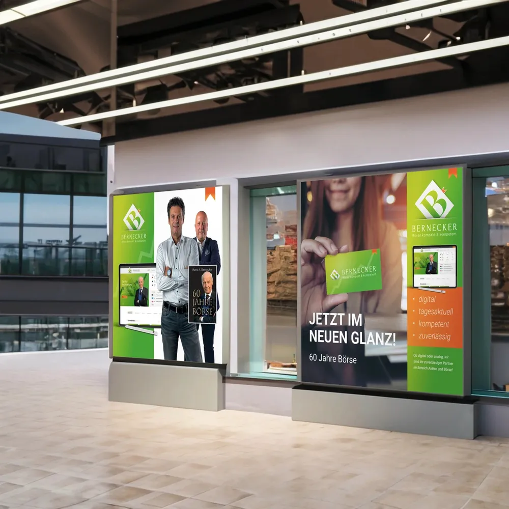 Two illuminated shop window displays in a shopping arcade, both in the new Bernecker design