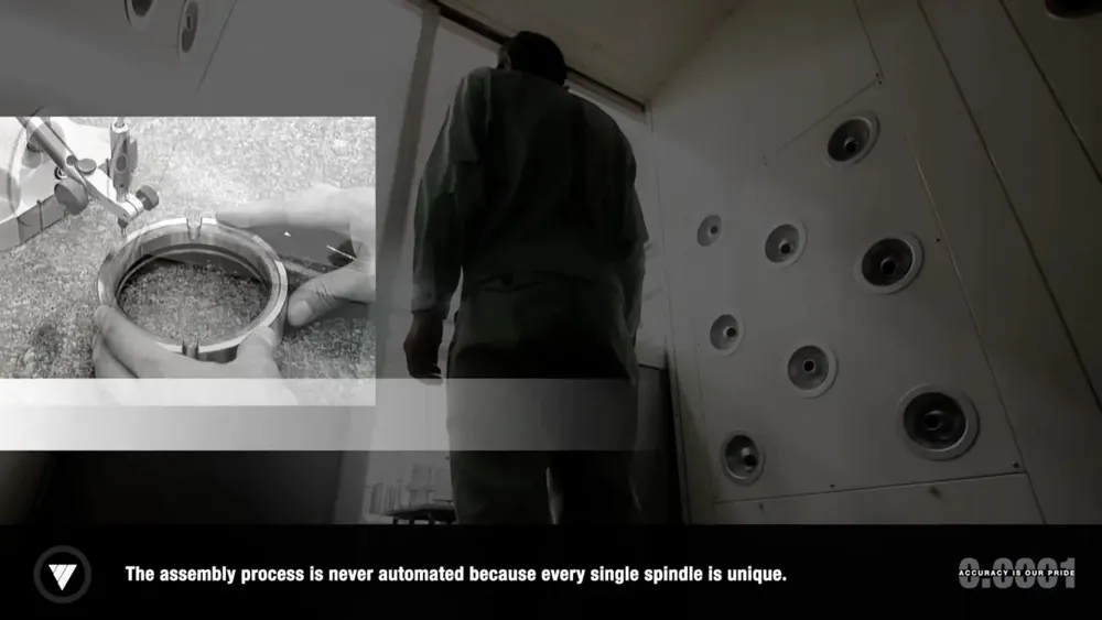 Film still from the assembly: an employee in front of the spindle production