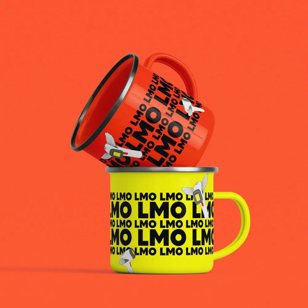 Two enamel mugs in red and yellow with the LMO lettering pattern