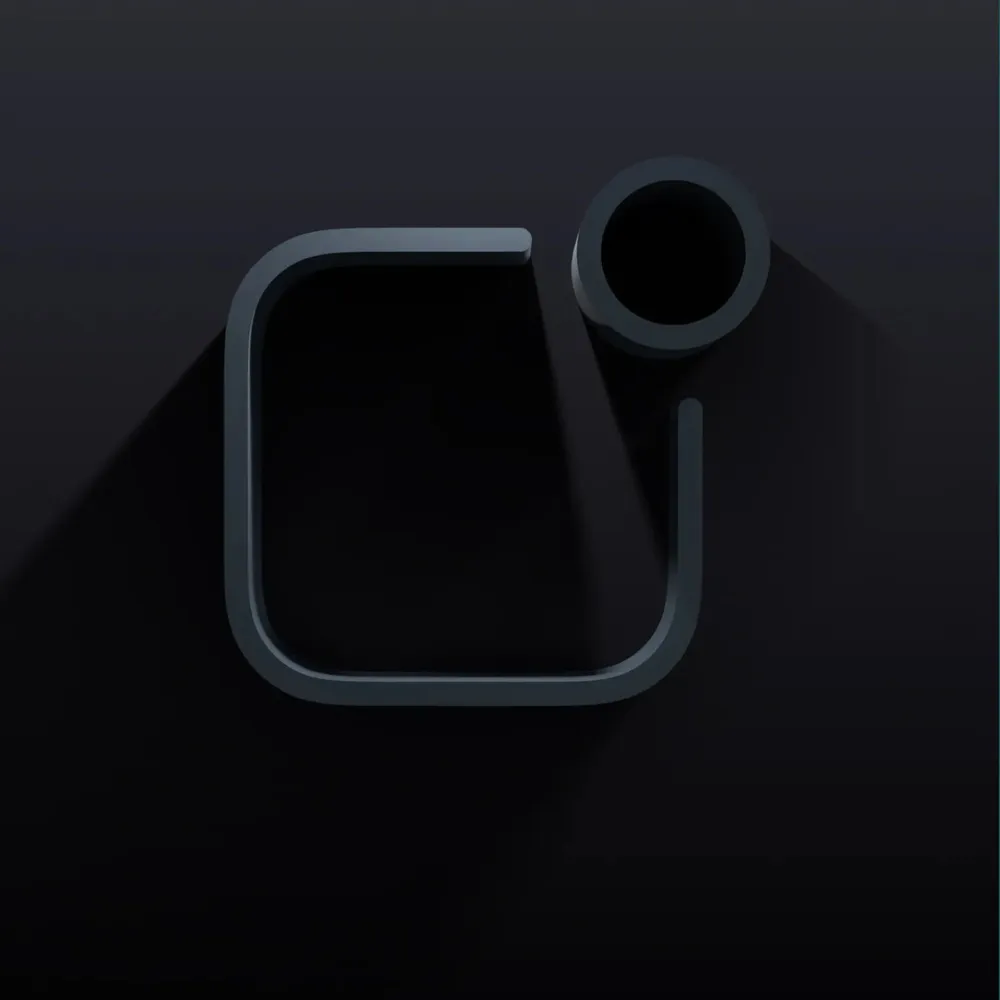 The same emblem as a sculptural 3D object in anthracite
