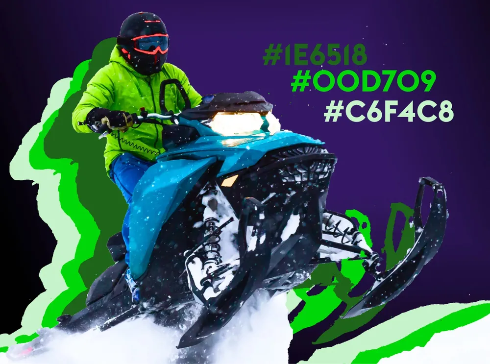 The green accent values of the premium line next to a rider in the snow