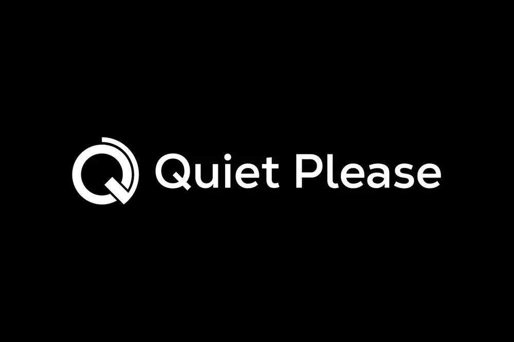 Brandmark and the “Quiet Please” lettering side by side in white on black