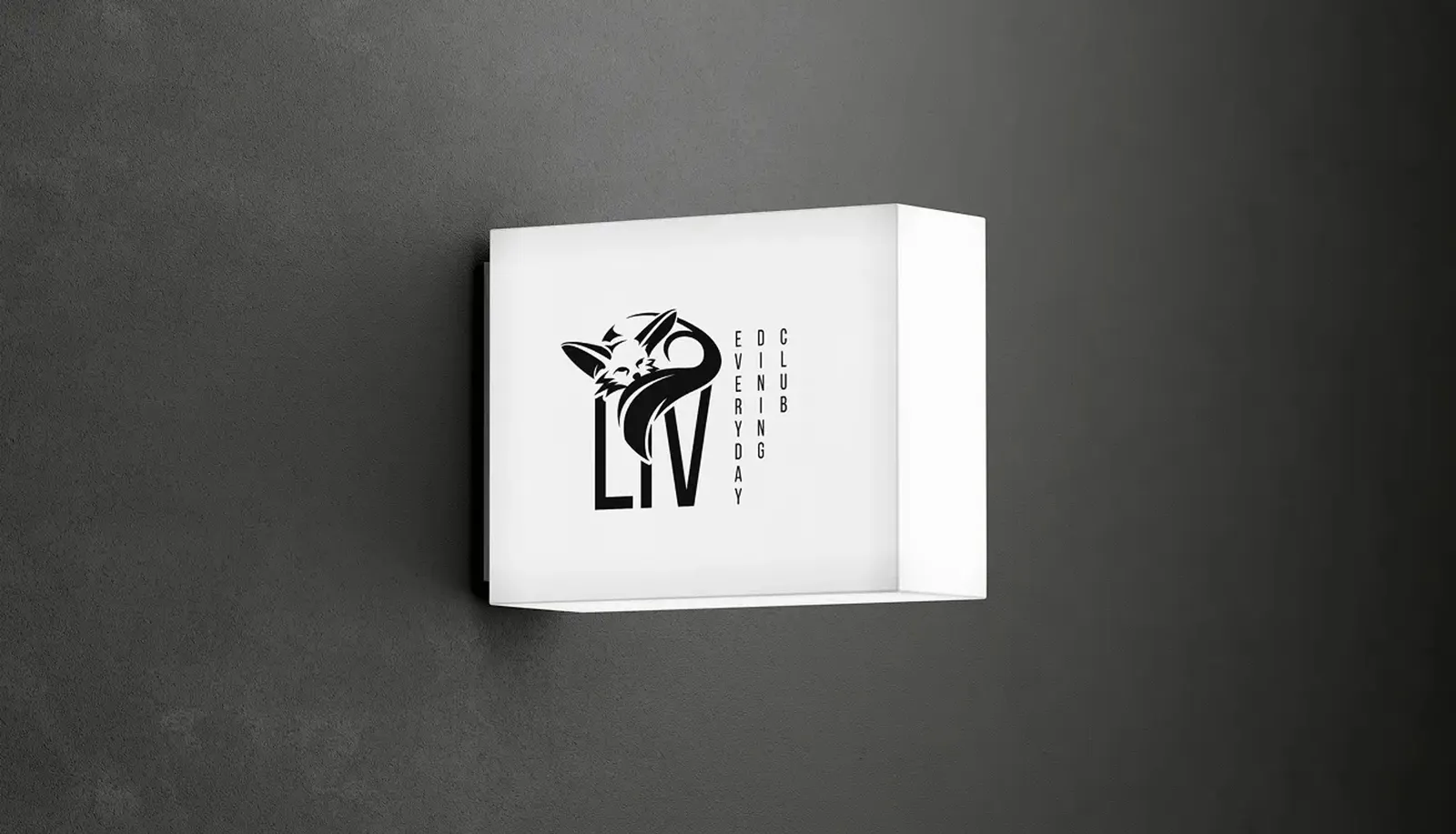 White light box with the Liv logo on a dark concrete wall