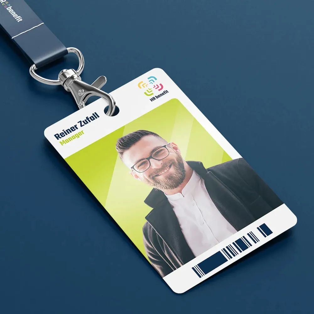 Employee ID card on a lanyard with photo, name and logo