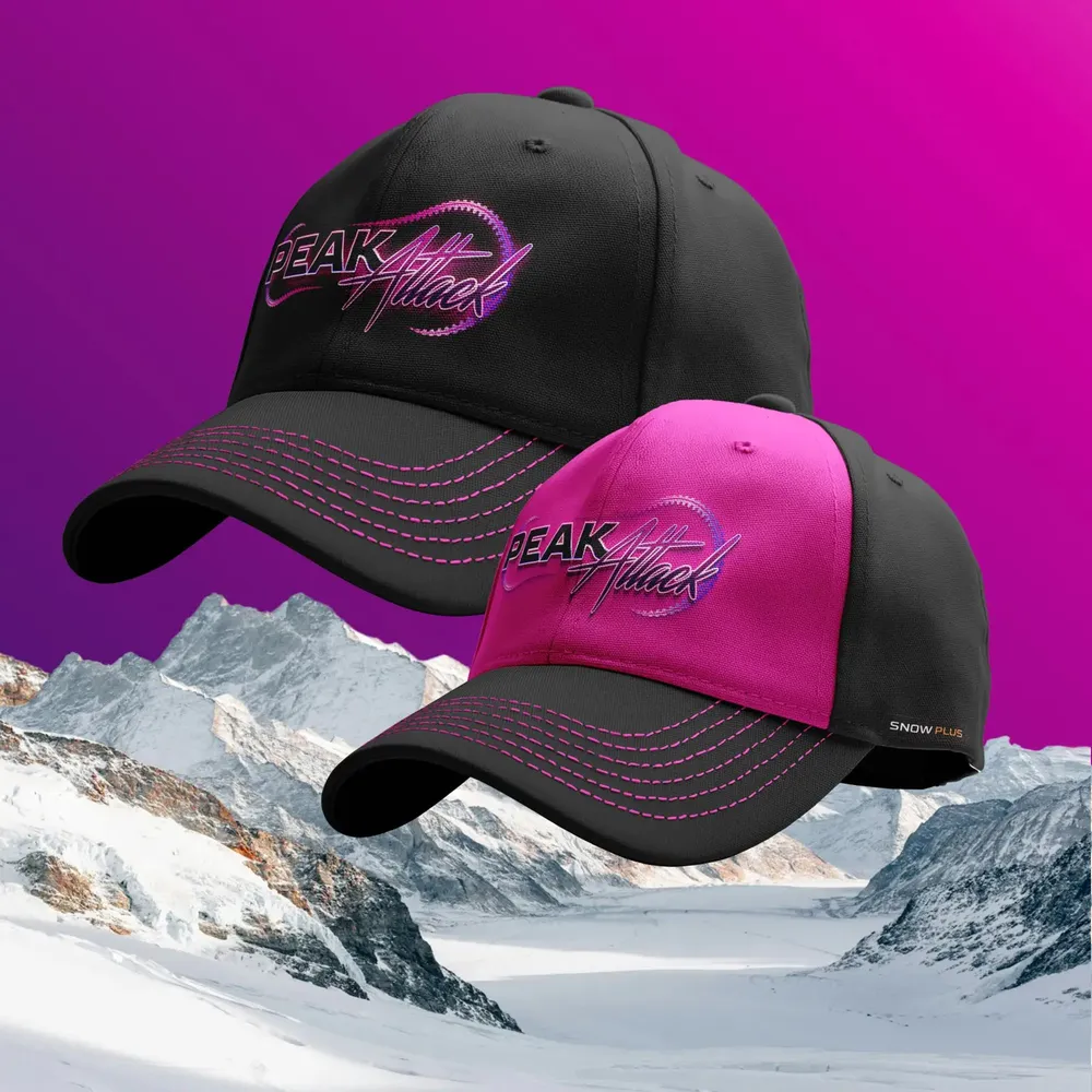 Two caps in black and magenta in front of a mountain panorama