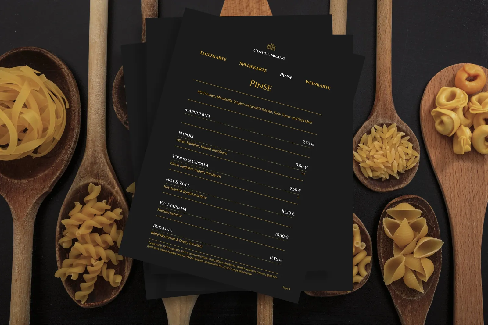 The menu fanned out on dark wood, surrounded by wooden spoons holding different kinds of pasta