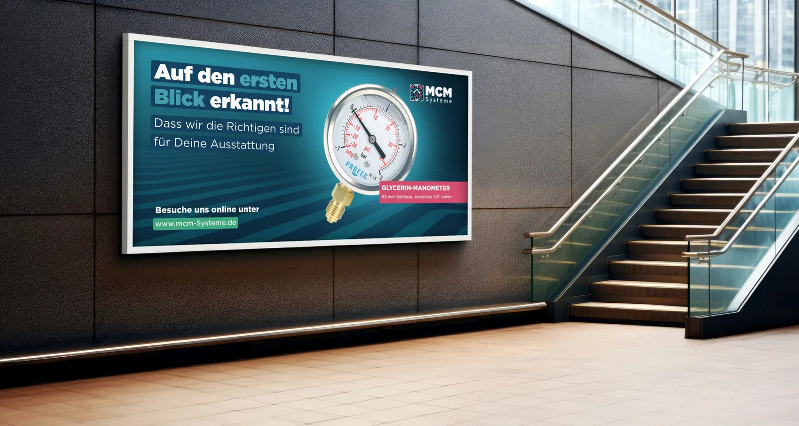 Advertising board in a foyer: “Auf den ersten Blick erkannt!” with a pressure gauge