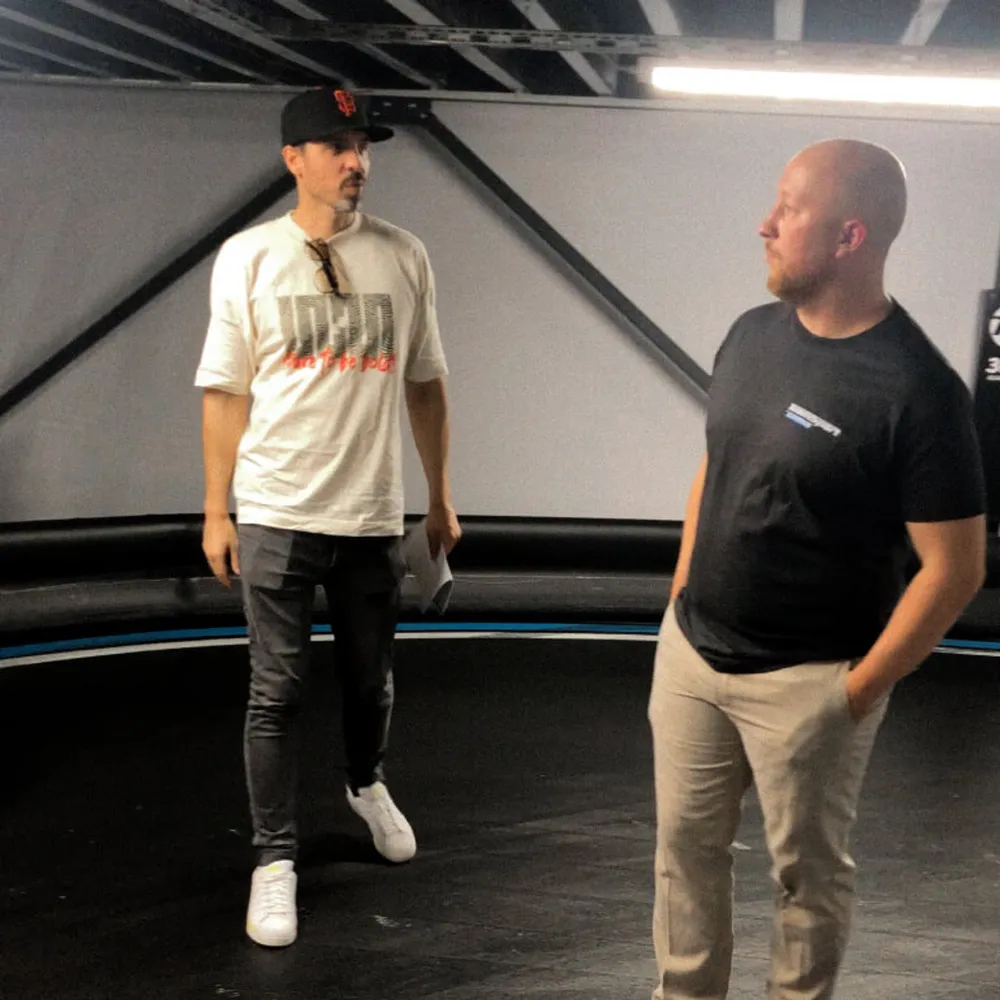 Patrick and a participant talking on the track
