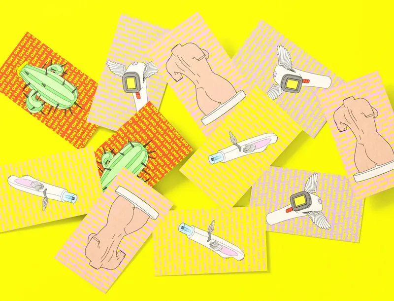 Scattered cards with line art motifs on a yellow background