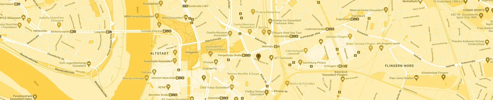 The map detail with the location in the old town, colored entirely in gold and sand tones