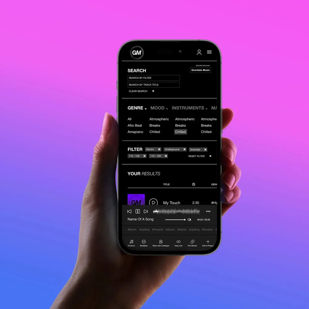 A hand holds a smartphone with the player running in front of a colorful gradient