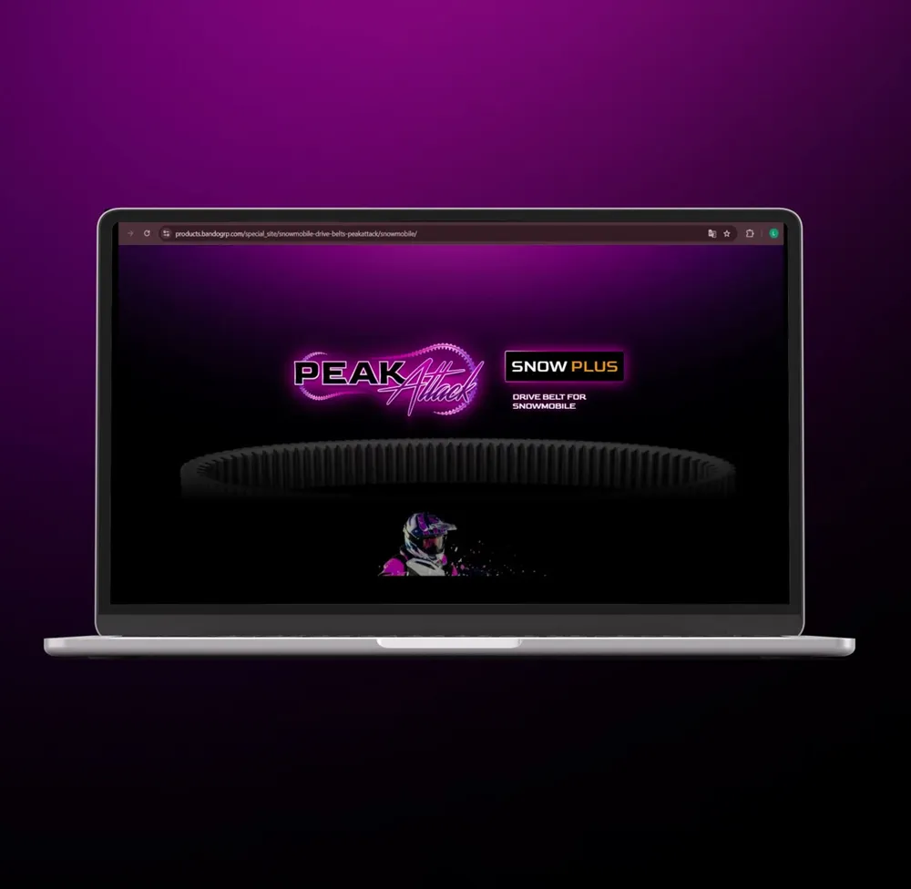 The landing page scrolls through, the drive belt stays in frame as a leitmotif