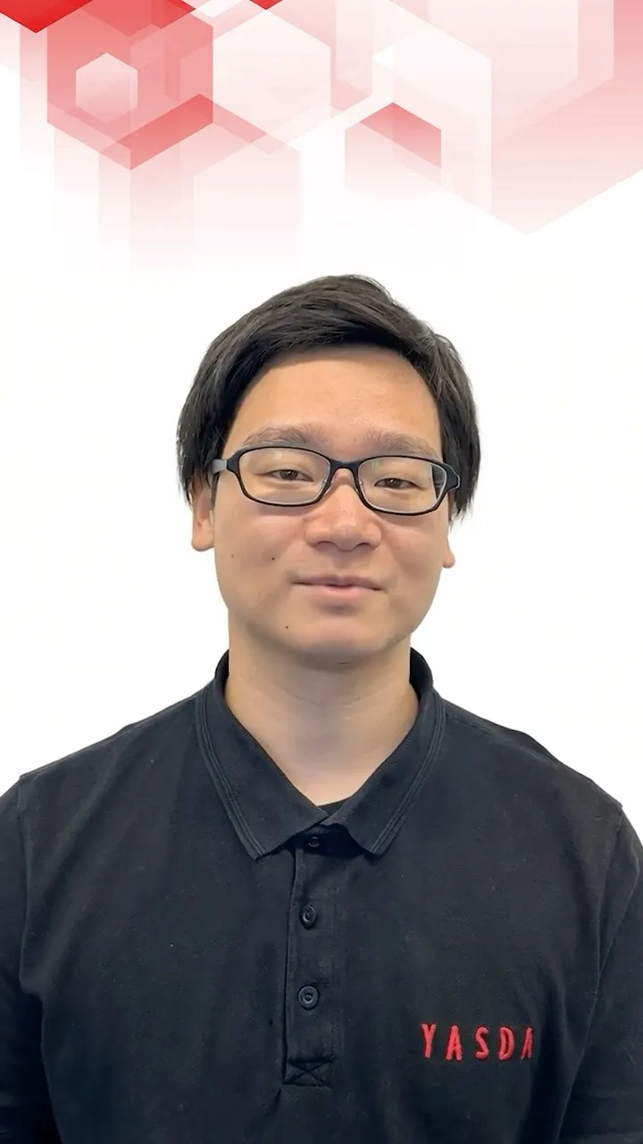 AI avatar of a YASDA engineer in a black polo shirt